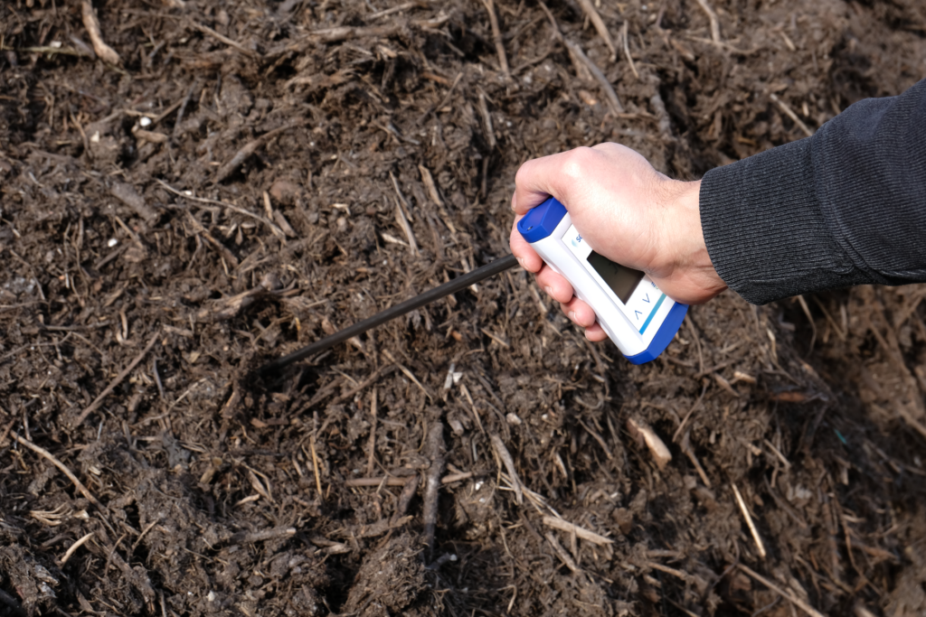 One-handed soil and compost thermometer in action with person ECO122