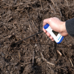 One-handed soil and compost thermometer in action with person ECO122